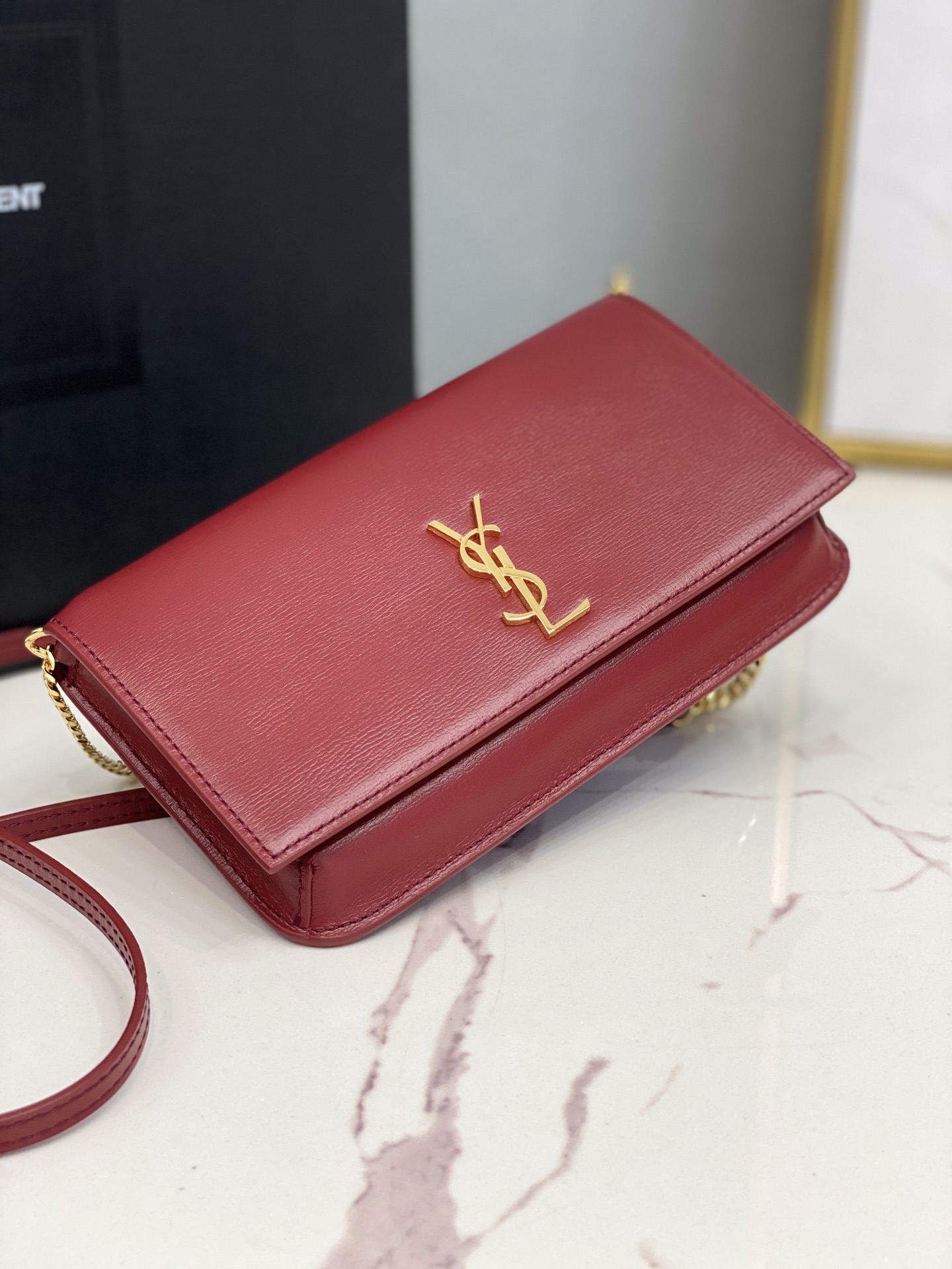 2020 cheap Saint Laurent monogram phone holder with strap in red smooth leather
